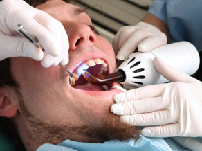 man receiving dental treatment 