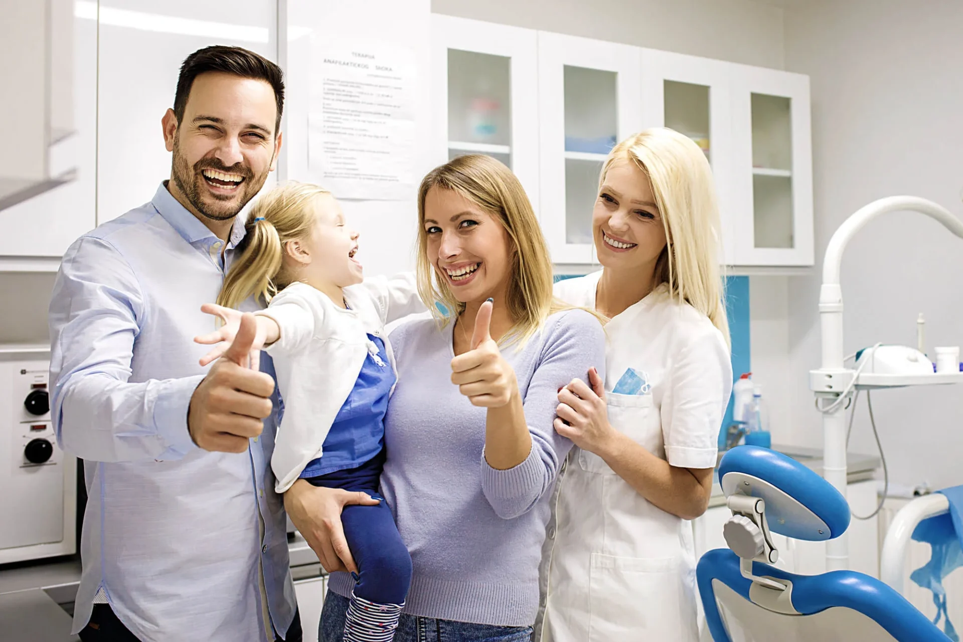 Child smiling during first dental visit at a family dentistry in Farmington Hills, MI.