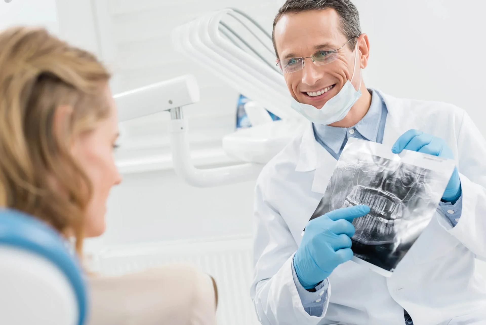 Dentist in Farmington Hills, MI explaining dental X ray results.