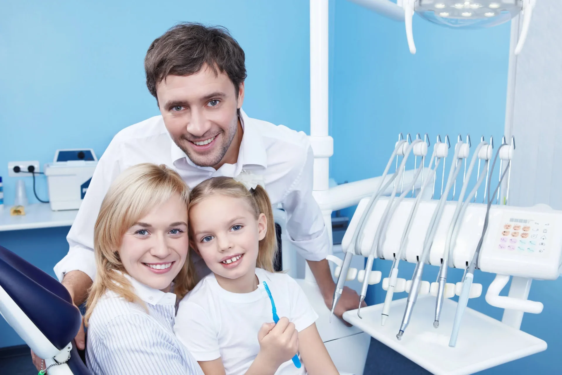 Happy families waiting in a room at a family dentistry in Farmington Hills, MI.