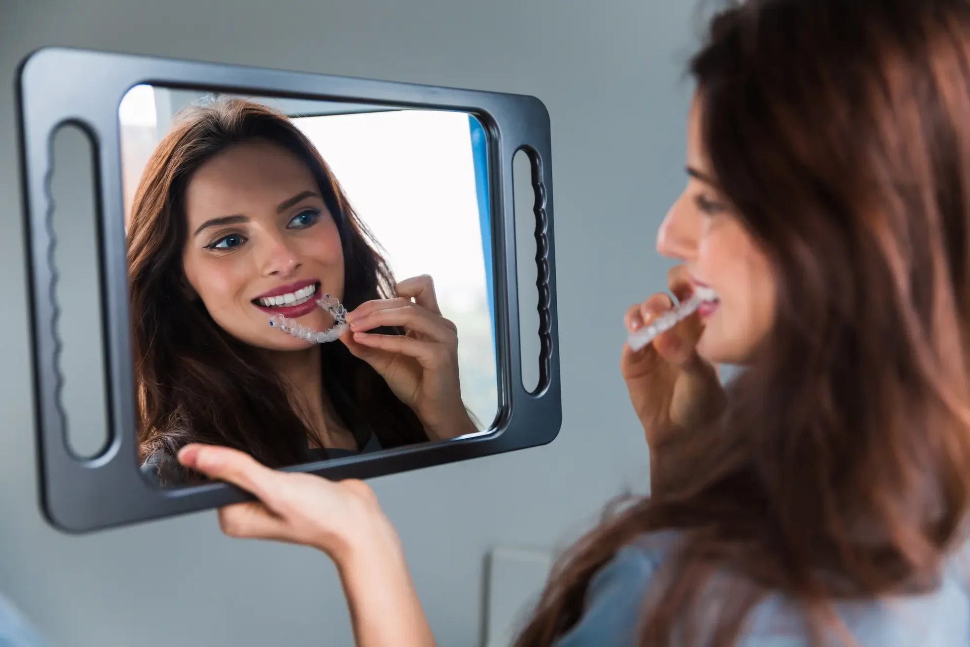 Young Woman Wearing Clear Aligners Farmington